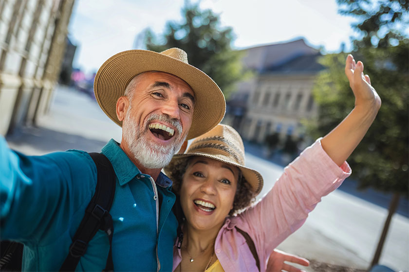 Elderly married couple exploring new city